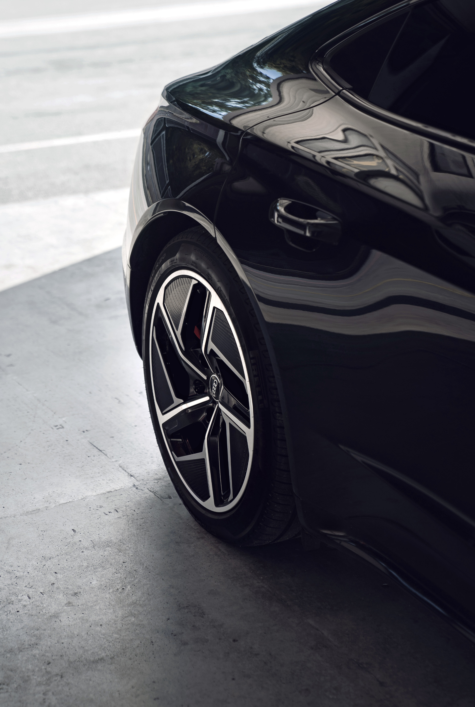 A rear view of Anna Veith's black Audi e-tron GT quattro.