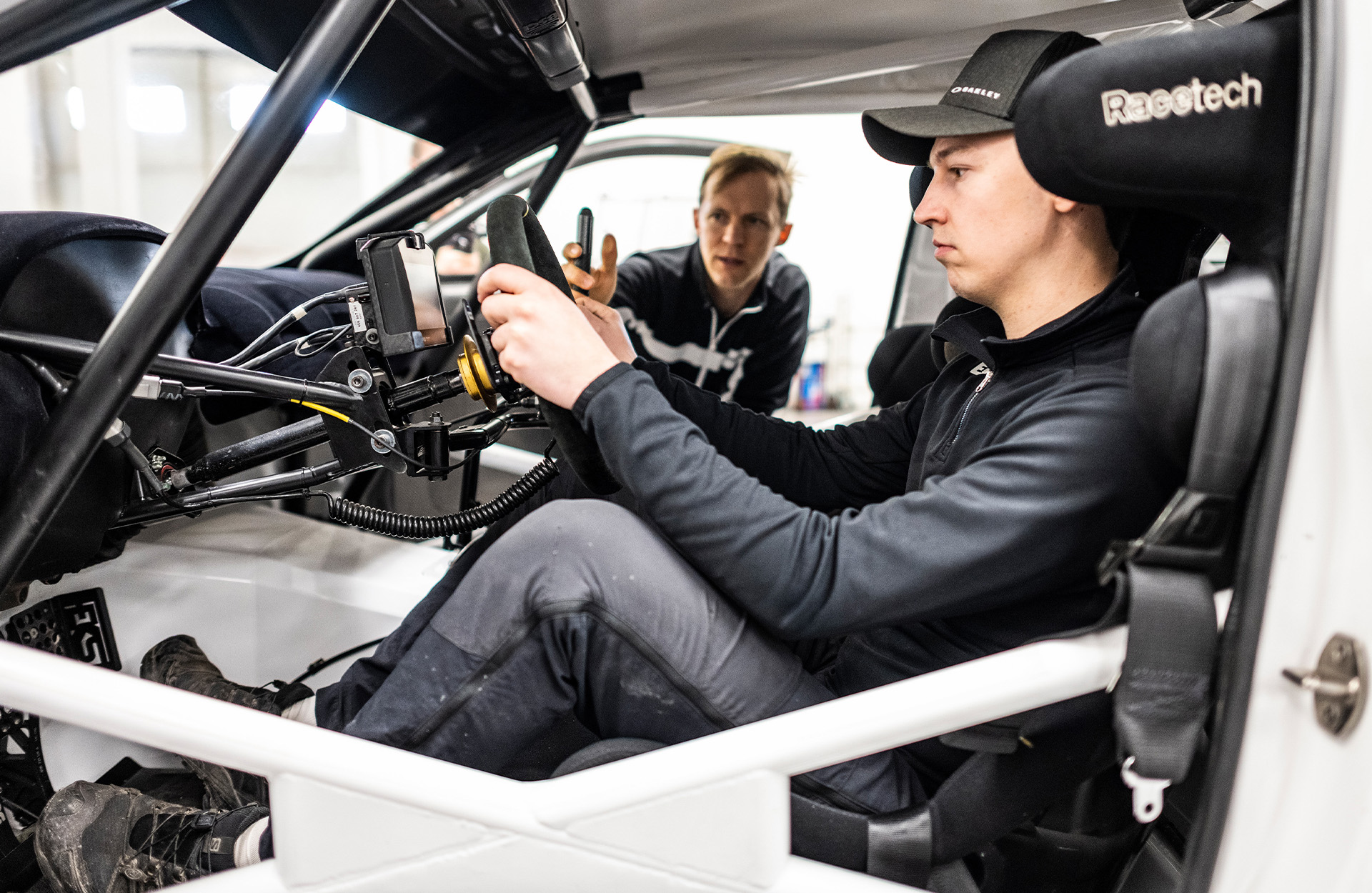 Ekström sitting at the wheel and talking.