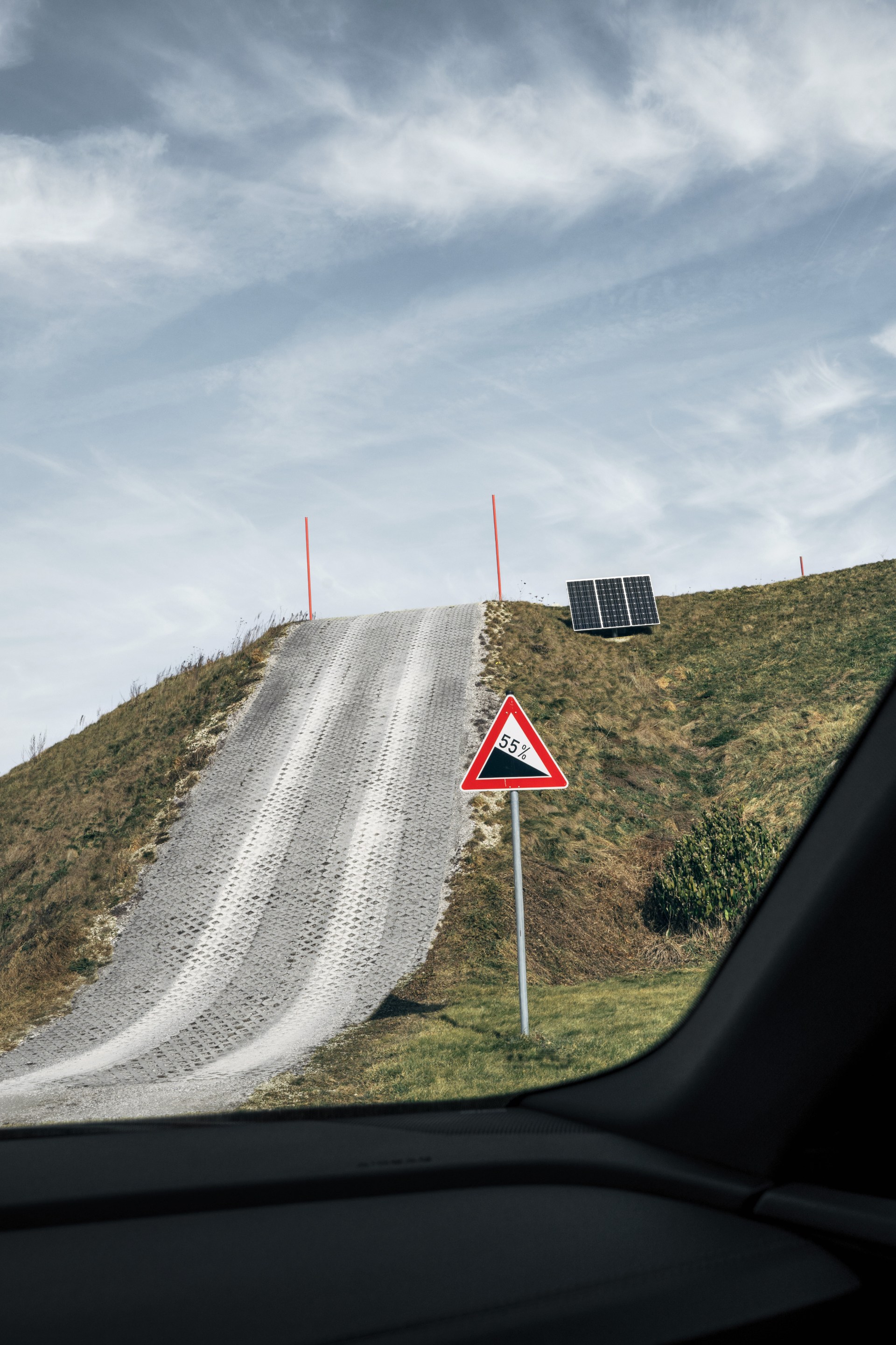 Front view of the Audi SQ8 Sportback e-tron driving up a hill.