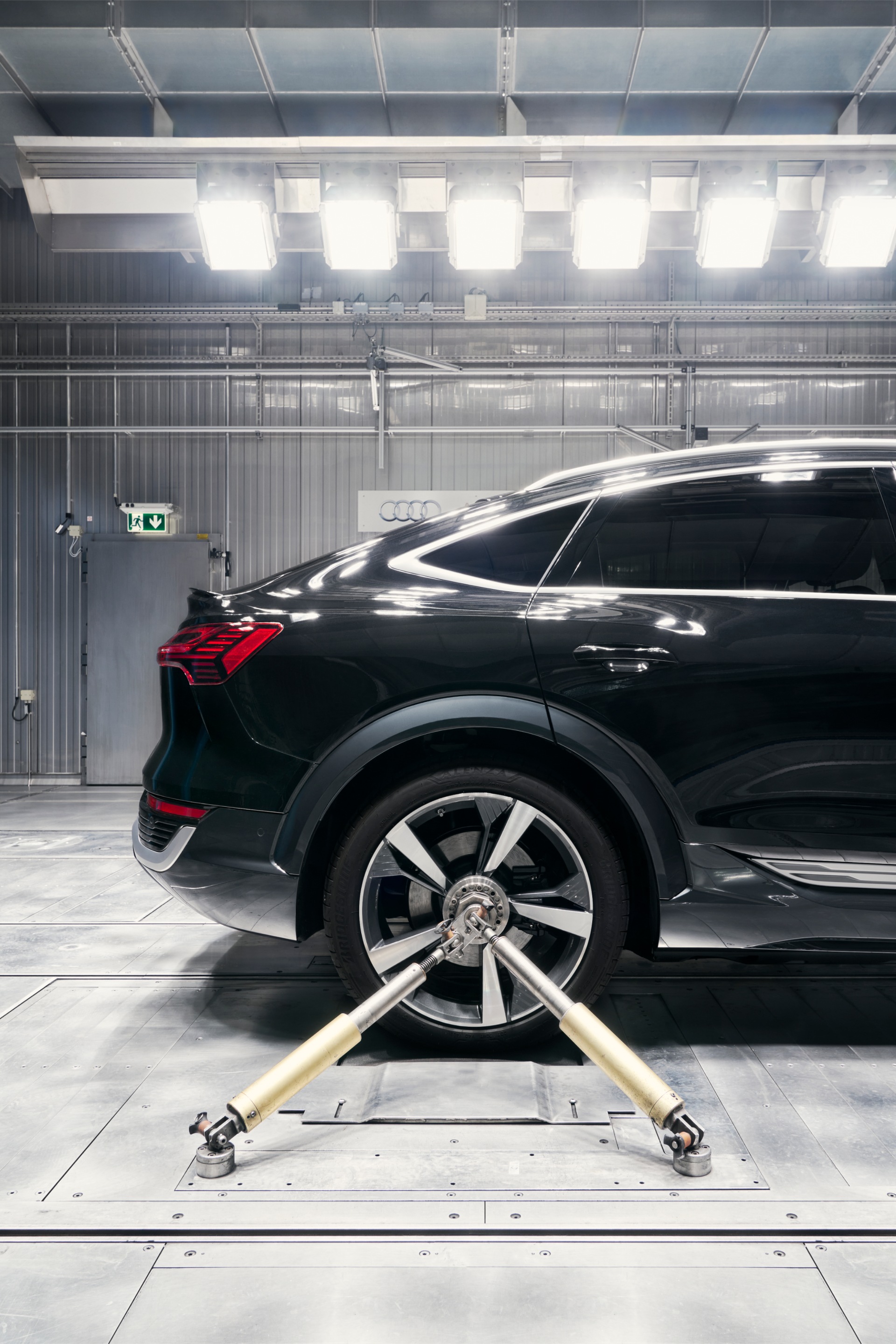 An Audi Q8 Sportback e-tron rear wheel clamped in place.